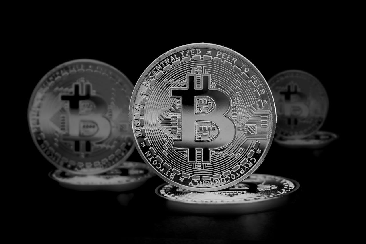 High contrast image of shiny Bitcoin coins symbolizing digital currency and finance.